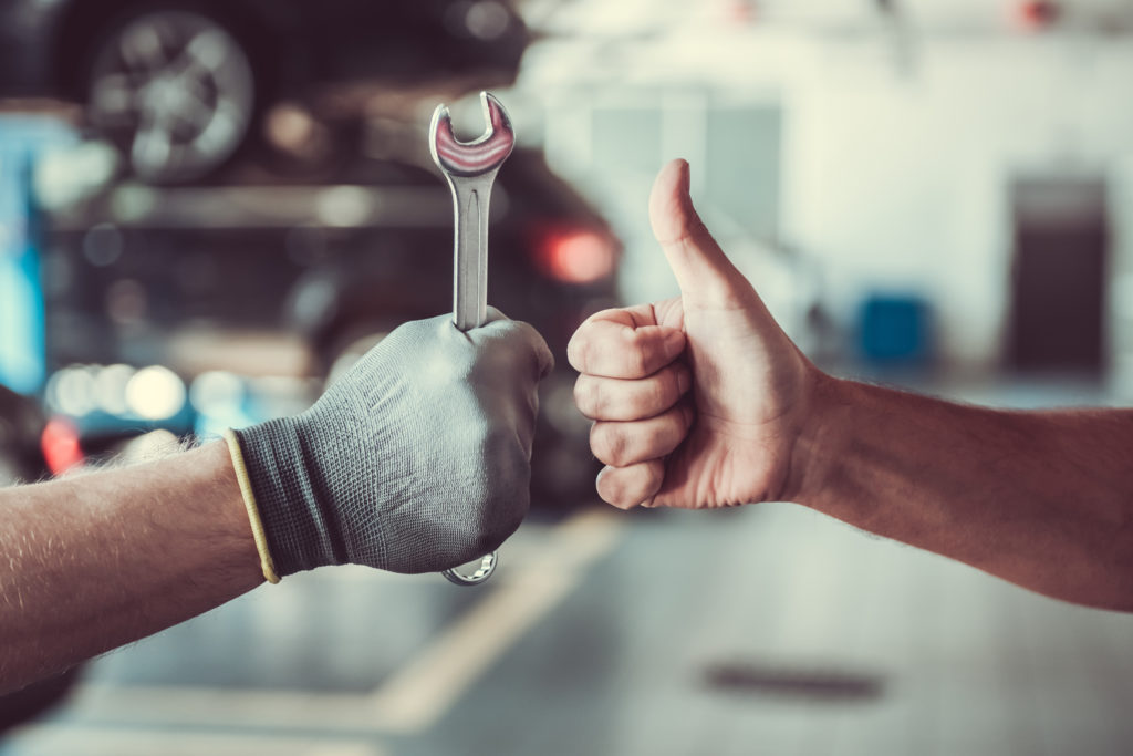 Auto Mechanic with Customer giving thumbs for Harris Quality Automotive